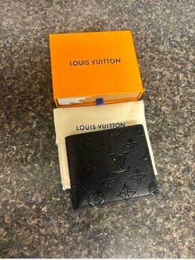 Louis Vuitton Men’s Black Embossed Leather Bi-Fold Wallet